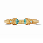 Gold cuff bracelet with blue faceted gemstones