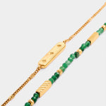 Gold chain bracelet with star engraved bar and beaded bracelet with green stones and gold accents
