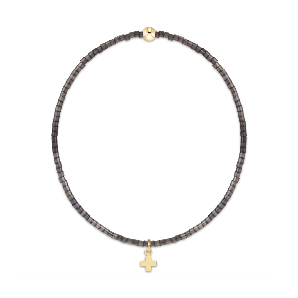 Black seed bead stretch bracelet with a gold bead and small gold cross charm