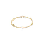 Gold beaded stretch bracelet with alternating large and small polished spheres
