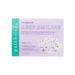 Digital product photograph by Patchology of a Keep Smiling aromatherapy lip gel sachet on a white background featuring a vertical teal brand logo a light lavender face and a decorative lip-shaped graphic filled with multicolored purple and pink patterns