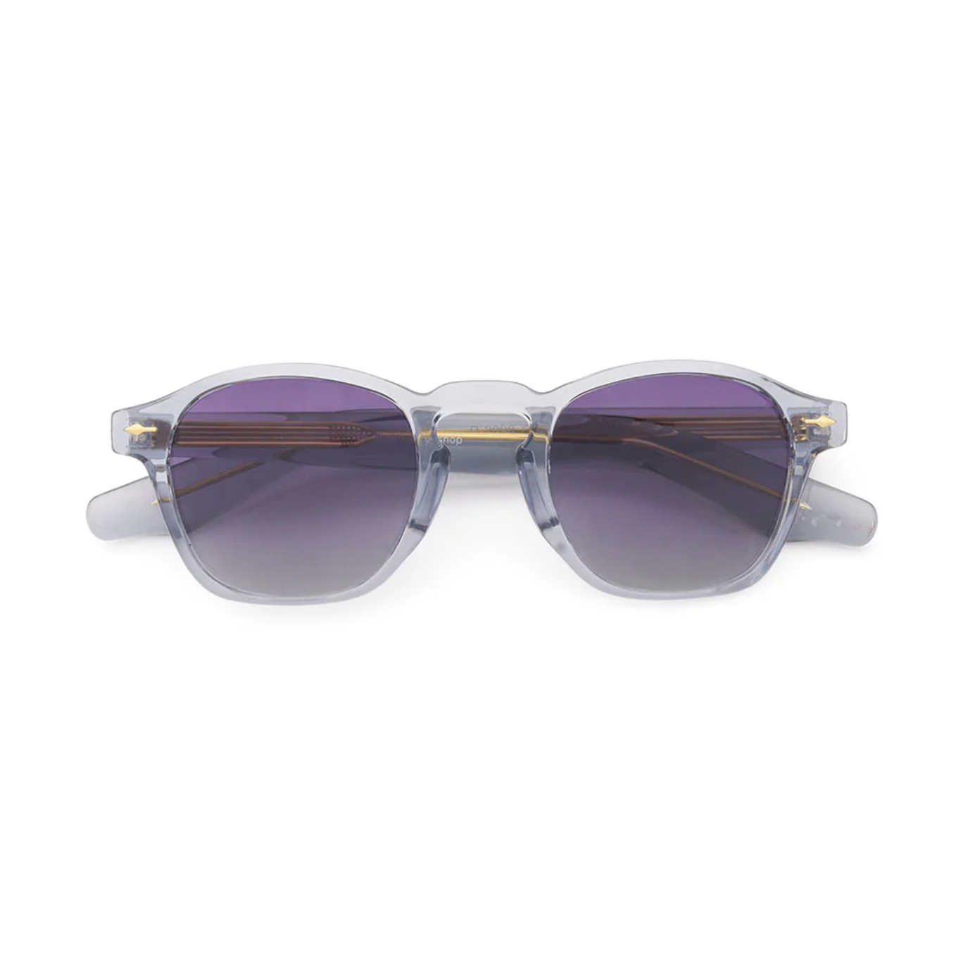 Sunglasses with clear frame and purple lenses on a white background