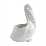 White ceramic pelican planter on a white background
