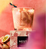 Nest New York candle with palm and passion flower print on glass and box with dragonfly and passion fruit
