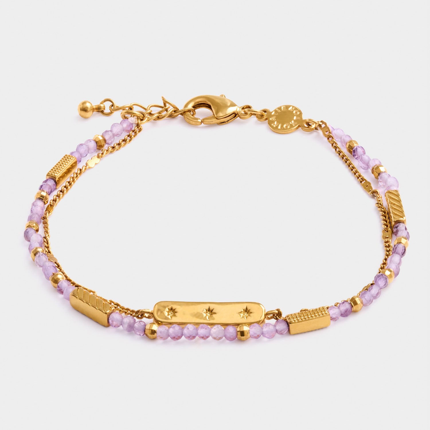 Gold chain bracelet with purple beaded strands and star engraved bar charm
