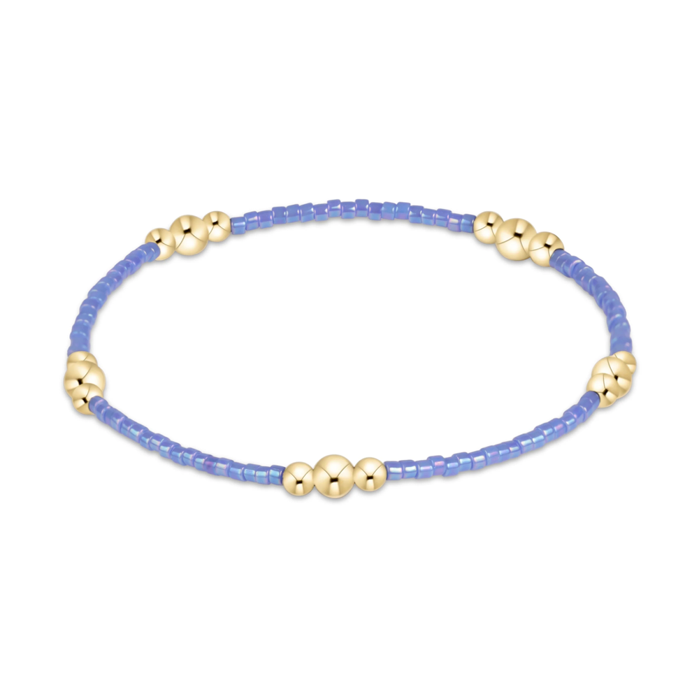 Periwinkle seed bead stretch bracelet with gold bead clusters
