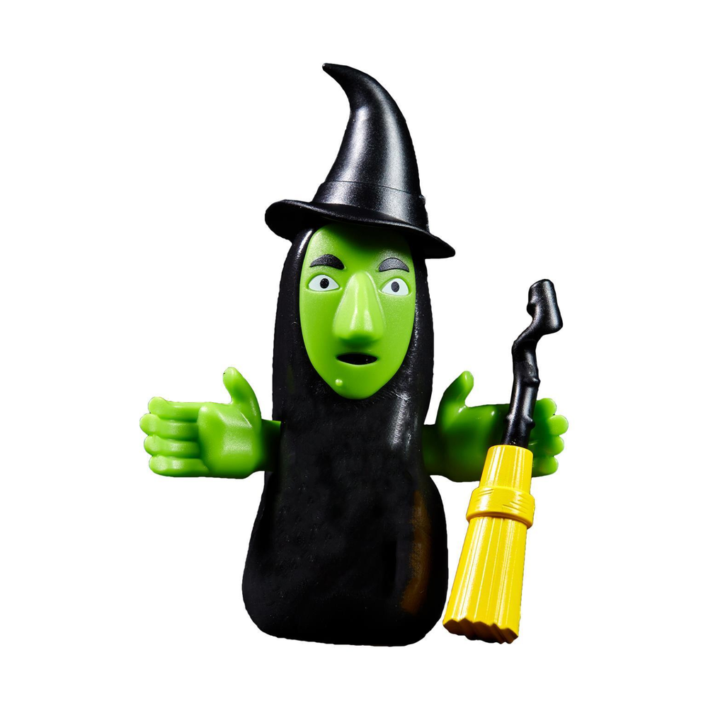 Green witch figurine wearing a black hat and holding a yellow broom