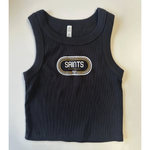 Photograph of a black New Orleans Saints ribbed crop tank top featuring a retro oval graphic with the text SAINTS FOOTBALL 1967 and gold and white concentric borders on a white background