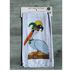 Tea towel with a pelican wearing a jester hat in its package