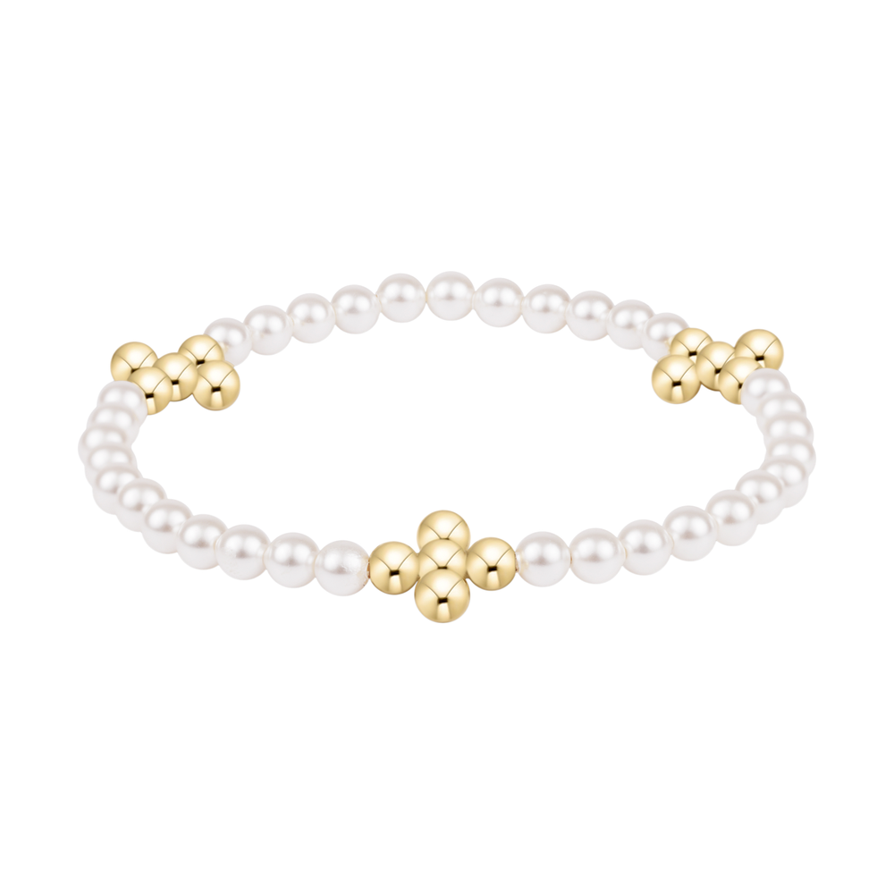 White pearl bracelet with three gold flower shaped bead clusters