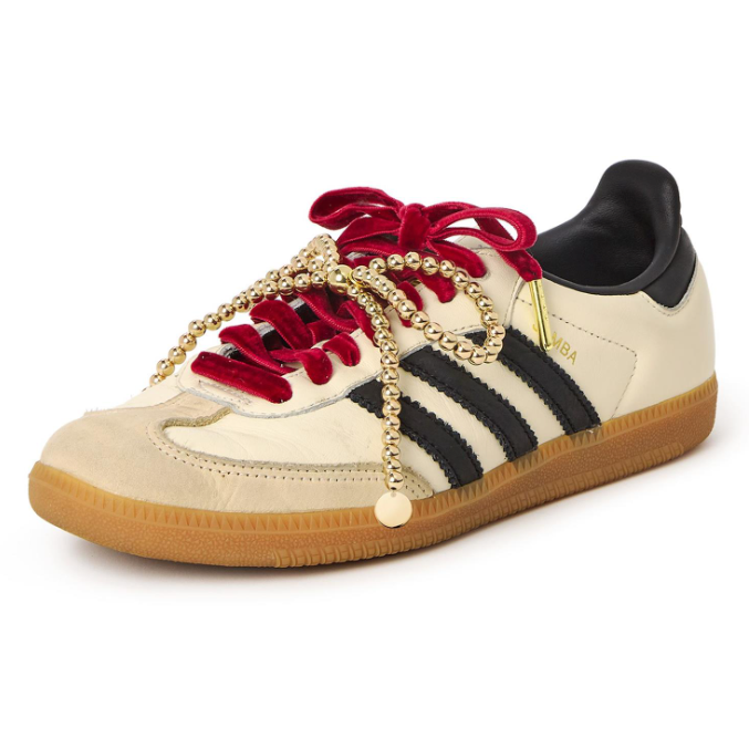 Adidas Samba sneaker with cream leather, black three stripes, luxurious red velvet laces, and an ornate gold beaded chain