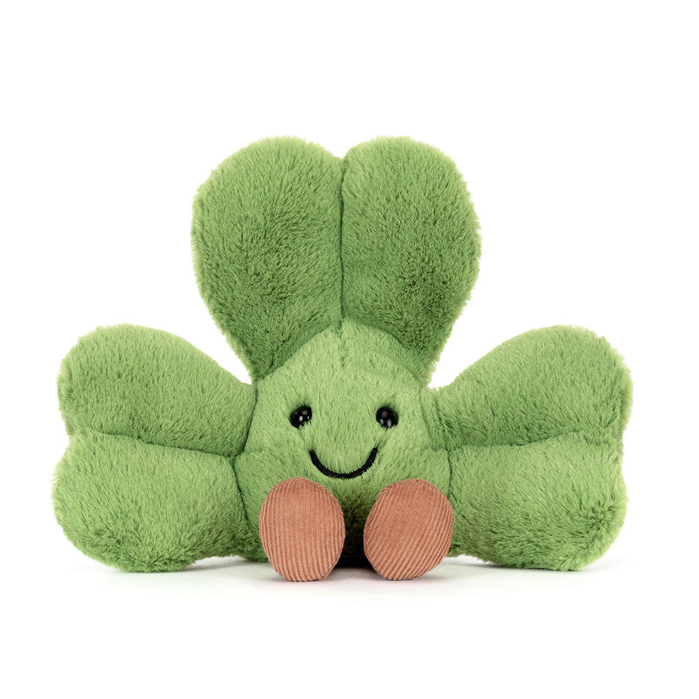 Green plush shamrock toy with brown corduroy feet and embroidered facial features