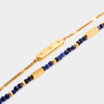 Gold chain bracelet with star engraved bar and beaded lapis lazuli bracelet with gold accents