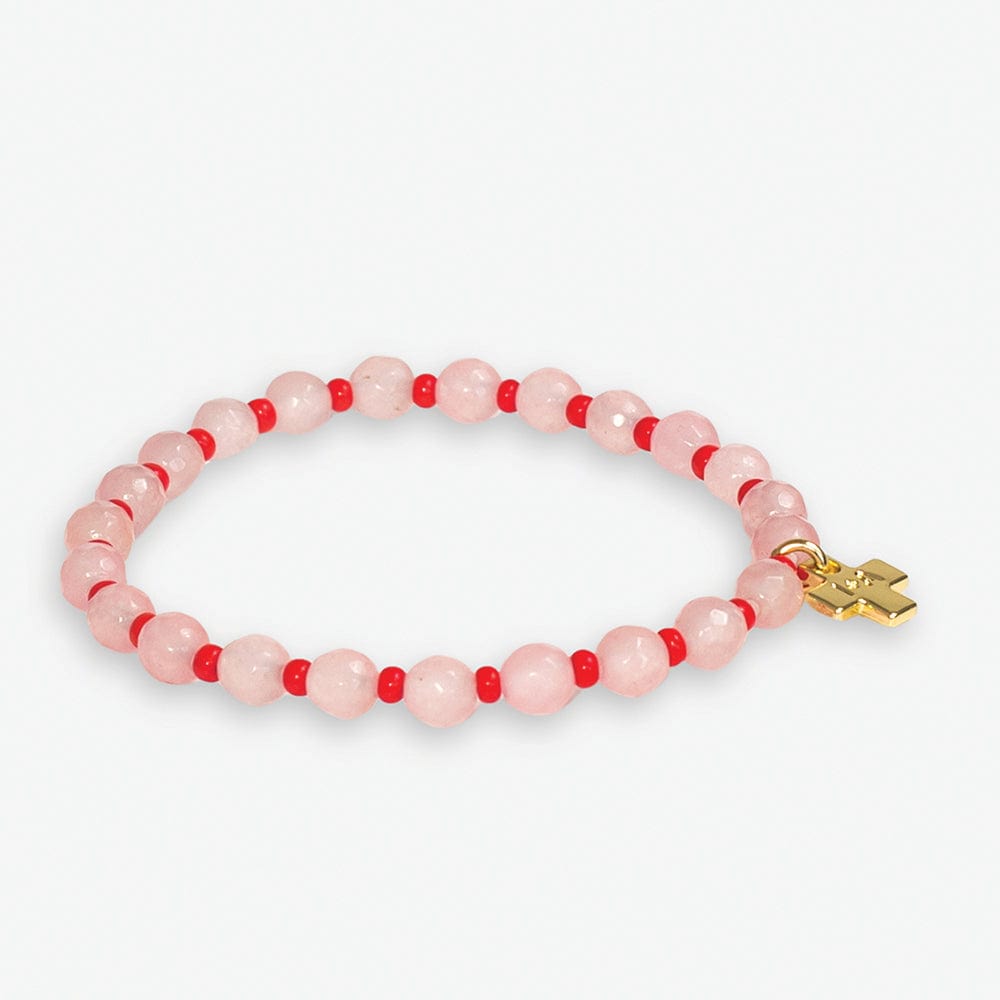 Beaded bracelet featuring faceted pale pink beads interspersed with small red beads and a gold-tone cross charm