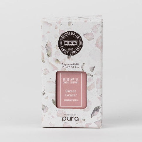 Product photograph of the Bridgewater Candle Company Sweet Grace fragrance refill box on a white background featuring a pink and grey stone chip pattern and a central blush pink label with the Pura logo