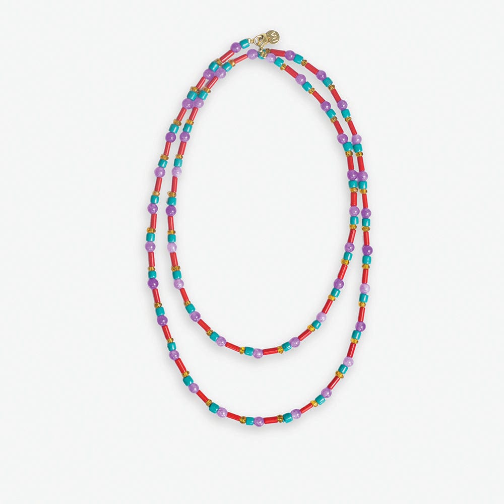 Beaded necklace a double strand design featuring vibrant red tube beads alternating with purple and turquoise beads accented by small gold spacers