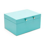 A small baby blue Kendall jewelry box with a sleek design, featuring a lid with a small square window and a gold and acrylic handle.