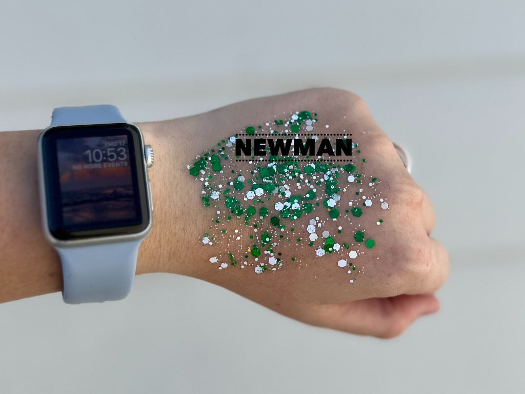 Photograph of a person's hand wearing a light blue Apple Watch displaying 10:53 and covered in bright green and white hexagonal glitter with the word NEWMAN superimposed