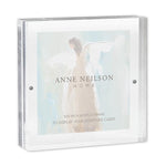 A 5x5 inch acrylic card frame with a magnetic closure, labeled with the brand 'Anne Neilson Home'.