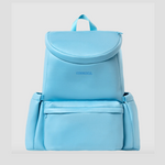 A blue Corkcicle backpack-style cooler with a front zipper pocket and adjustable shoulder straps.