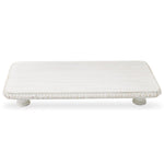White distressed wooden rectangular pedestal tray featuring a decorative beaded edge and two small turned feet