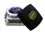 Product photography of Elektra Cosmetics Voodoo Violet Bolt Balm glitter in a clear jar featuring iridescent purple and blue flakes with a black lid displaying the gold Elektra Cosmetics logo and lightning bolt