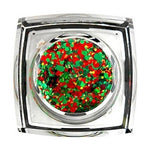 A clear square pot filled with chunky red and green holiday glitter including small gold flecks