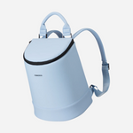 Corkcicle product photography showing a baby blue backpack with a black zipper, curved top handle, and adjustable straps