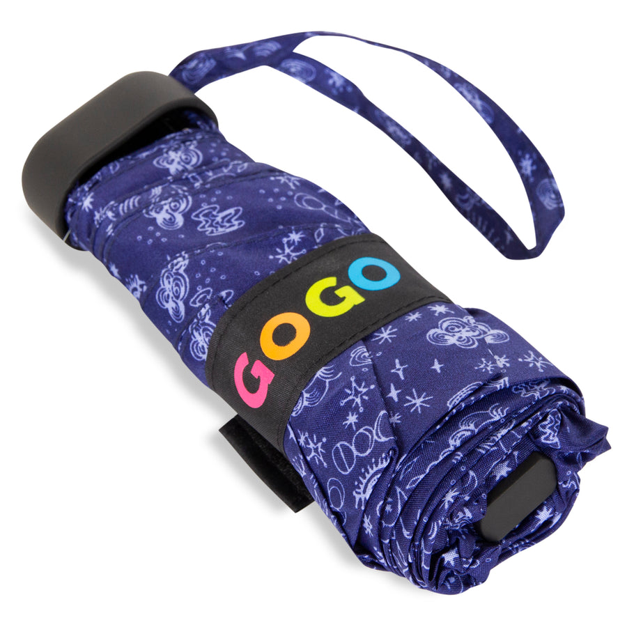 Product photography of a dark blue folded umbrella featuring a white abstract starry pattern, a black strap with the multicolored GOGO logo, and a matching dark blue wrist strap