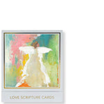 Abstract painting depicting a white angel with prominent wings and a flowing gown, set against a vibrant textured background of pastel pink, green, and yellow strokes, presented on a Love Scripture Cards box with a gold border