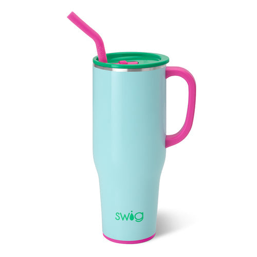 Swig insulated travel mug with a light blue body hot pink handle and straw and a vibrant green lid with the Swig logo