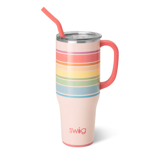 Swig Life branded light pink insulated tumbler featuring vibrant horizontal rainbow stripes, a coral handle, and a bent straw