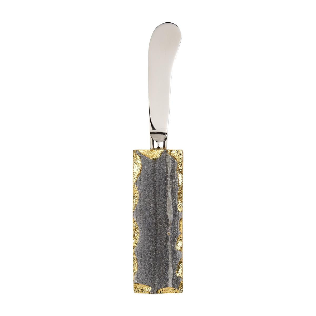 A modern butter knife featuring a polished silver blade and a dark grey rectangular handle with organic rough gold gilded edges