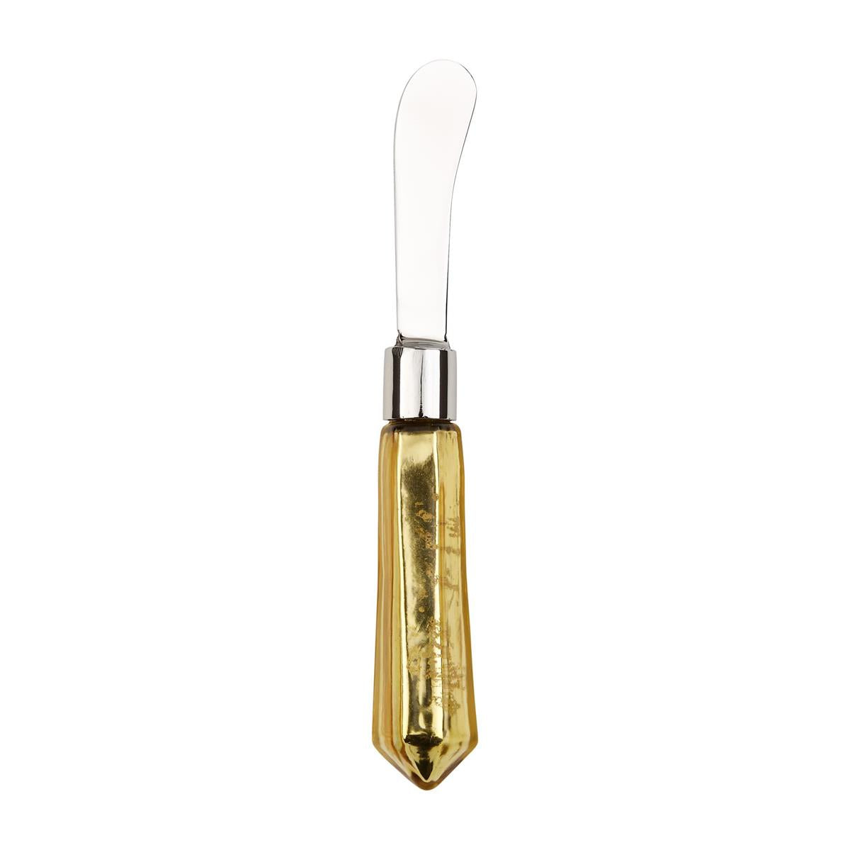 A shiny stainless steel butter spreader featuring a silver ferrule and a faceted metallic gold handle