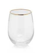 Photograph of a clear ribbed stemless glass with a delicate gold rim presented as a studio shot
