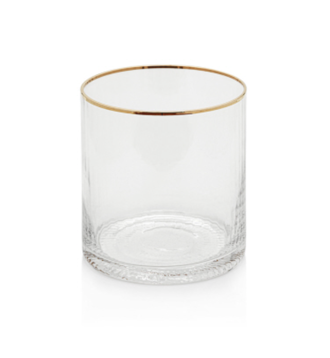 Clear glass tumbler with a gleaming gold rim, subtly fluted sides, and a decorative concentric pattern on its base