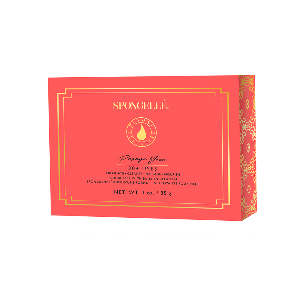 Product photography of a Spongellé Papaya Yuzu Pedi-Buffer box in vibrant coral red with elegant gold ornate borders and a central Beyond Cleanse logo indicating 30 plus uses