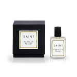Saint Parisian Peony perfume featuring a sleek black box with a gold-bordered white label and a clear glass bottle with a black cap and matching branding
