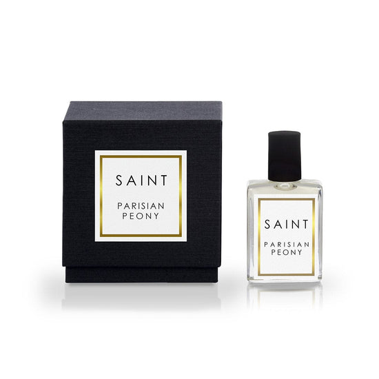 Saint Parisian Peony perfume featuring a sleek black box with a gold-bordered white label and a clear glass bottle with a black cap and matching branding