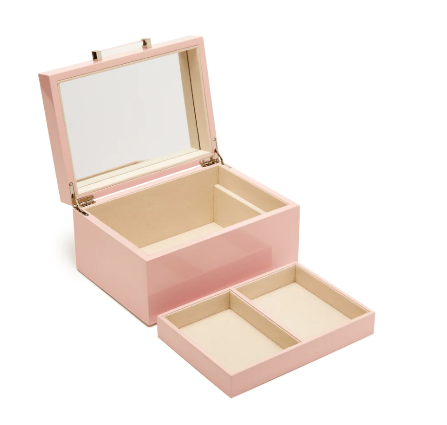 small pink jewelry box with a large inner compartment showing a removed tray with two small compartments.