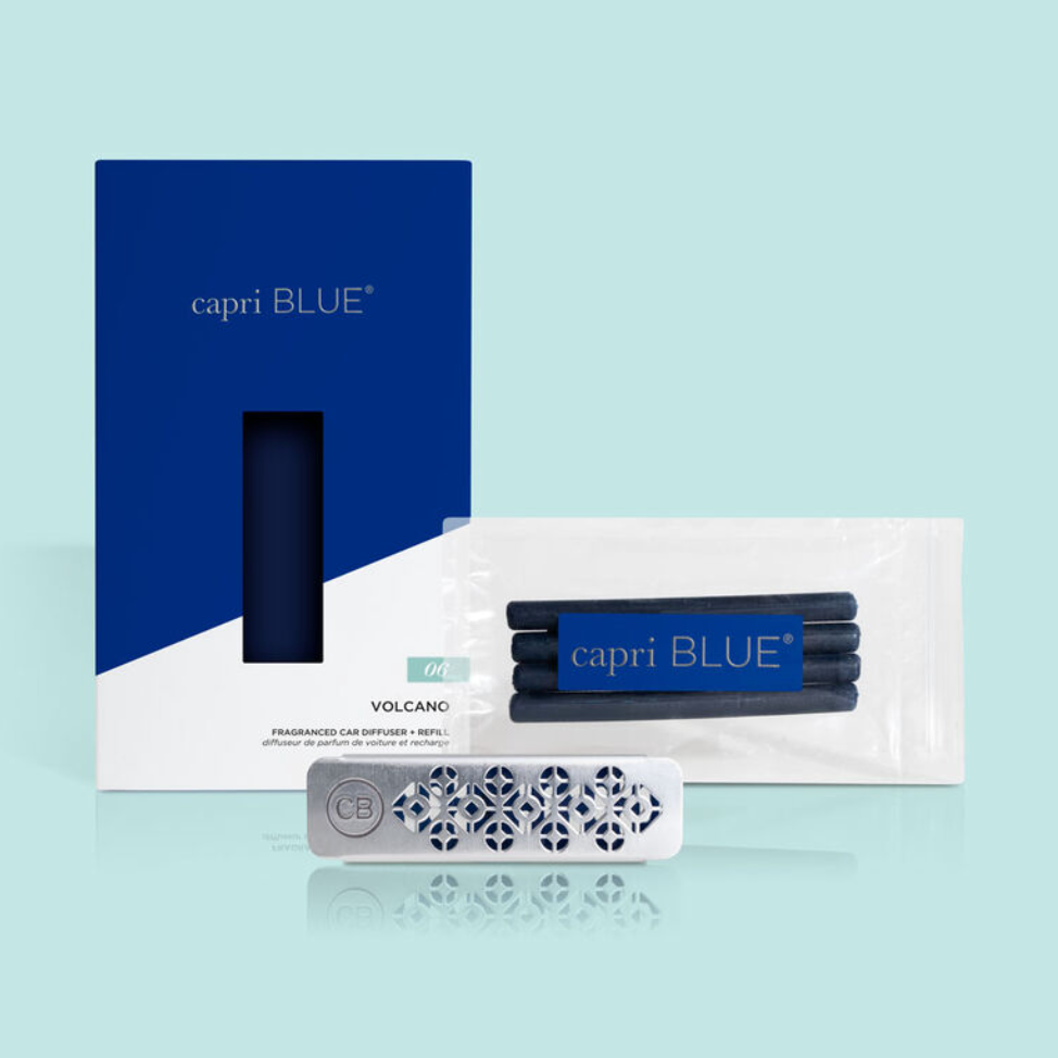 A Capri Blue Volcano car diffuser set, including a blue cylindrical diffuser and four blue fragrance reeds, packaged in a white box with a blue background.