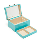 interior shot of a blue jewelry box with top container removed showing a large interior space on a white background