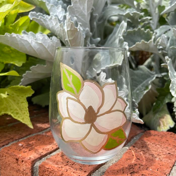 Clear glass stemless wine glass with hand painted magnolia design.