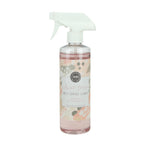 A clear spray bottle labeled 'Multi-Surface Cleaner' with a floral pattern and a white spray nozzle, containing a pink liquid.